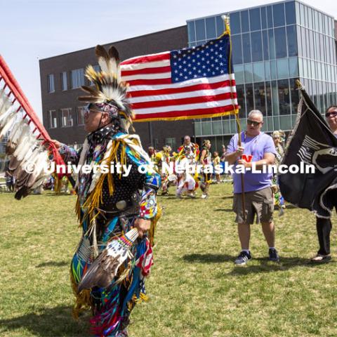 Scott Aldrich, head man dancer (left) leads the colors into the circle at the start of the UNITE powwow on April 23. 2022 UNITE powwow to honor graduates (K through college). Held April 23 on the greenspace along 17th Street, immediately west of the Willa Cather Dining Center. This was UNITE’s first powwow in three years. The MC was Craig Cleveland Jr. Arena director was Mike Wolfe Sr. Host Northern Drum was Standing Horse. Host Southern Drum was Omaha White Tail. Head Woman Dancer was Kaira Wolfe. Head Man Dancer was Scott Aldrich. Special contest was a Potato Dance. April 23, 2023. Photo by Troy Fedderson / University Communication.